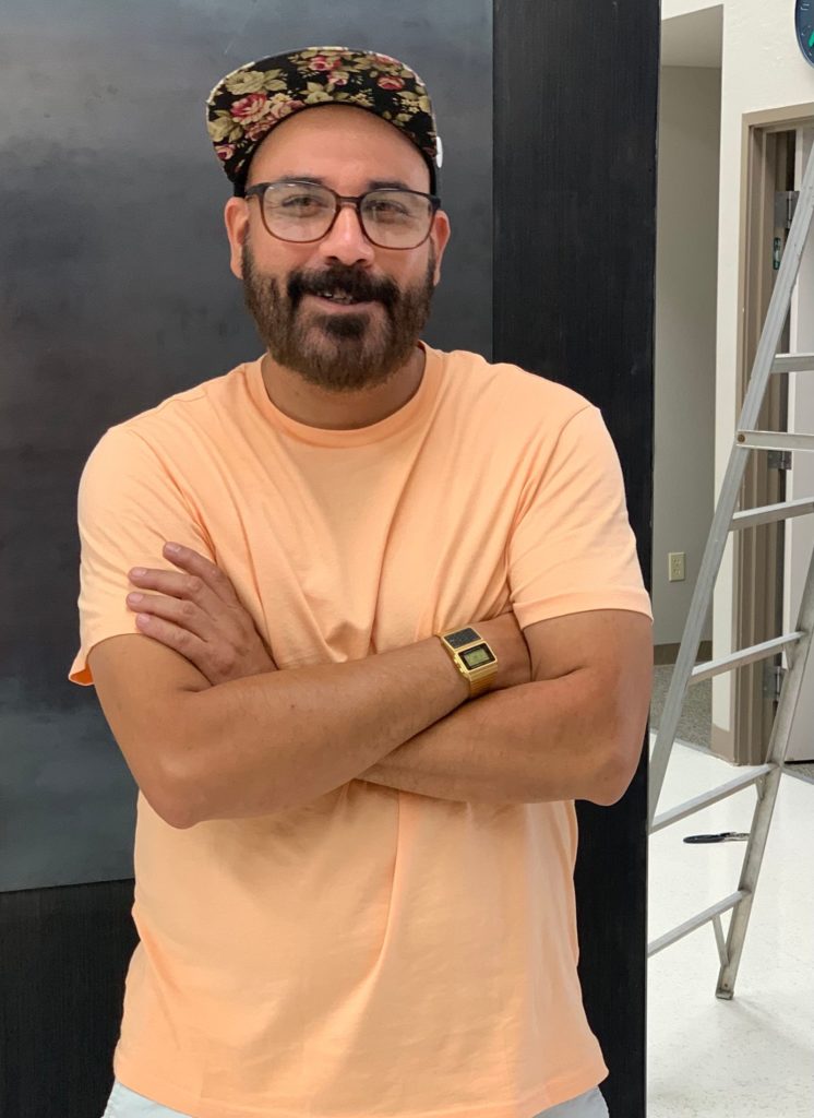 Karlo Henry Velazquez, inside The Art Hunger gallery space in the newly revitalized IOOF building in Redding. Photo by Annelise Pierce. 