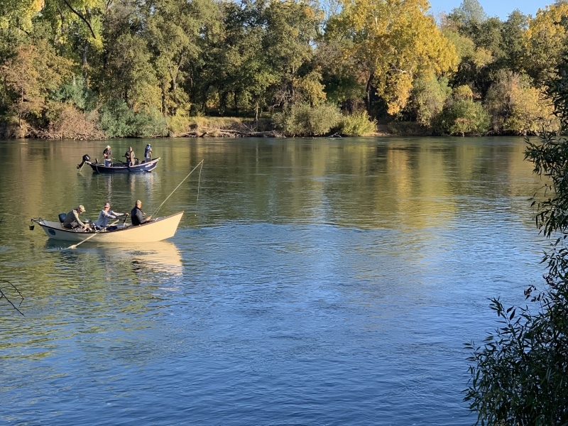 river with several small fishing boats